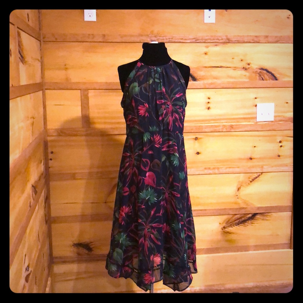 High neck, sleeveless floral dress.